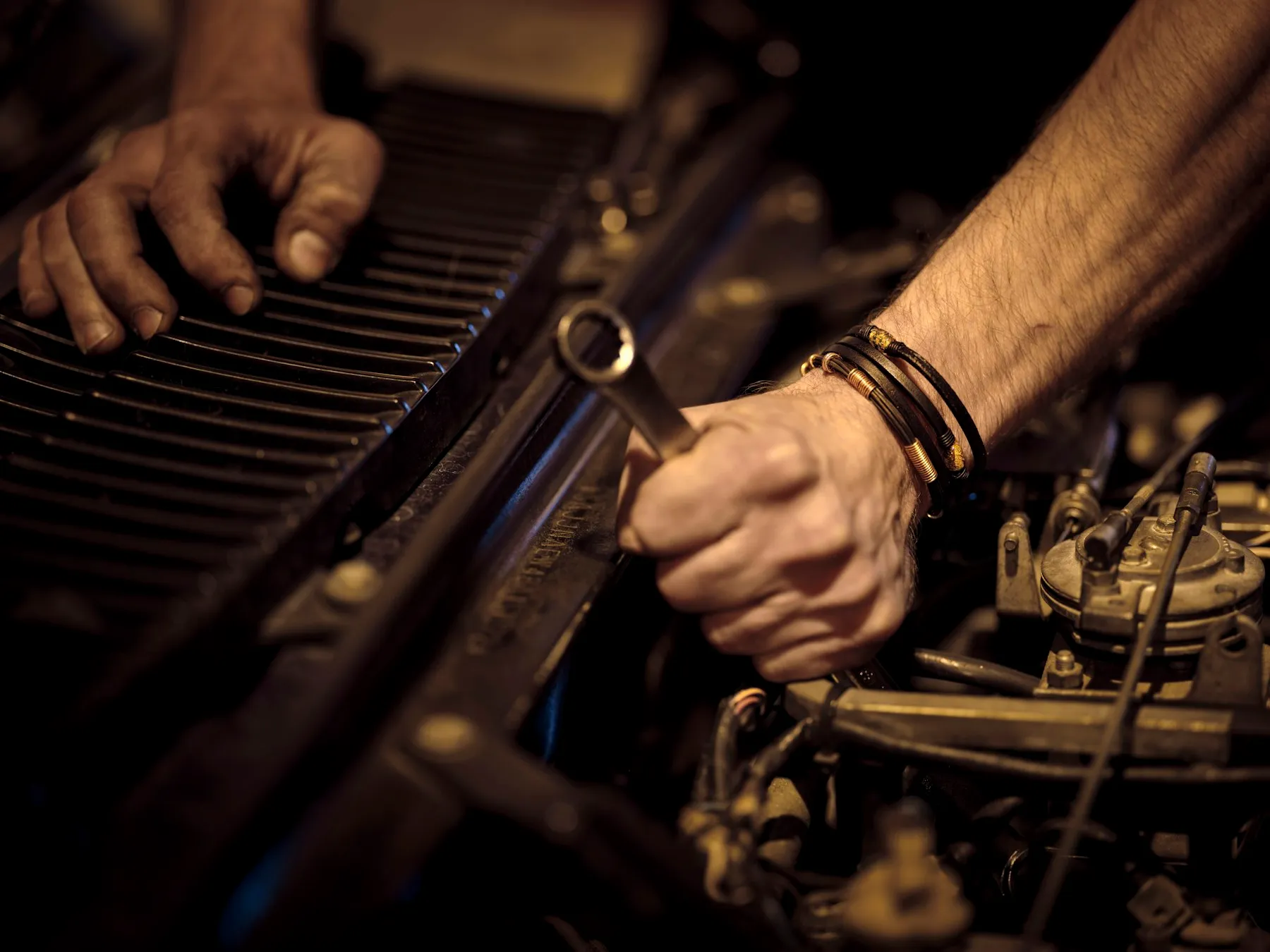 Mechanic working in an engine bay